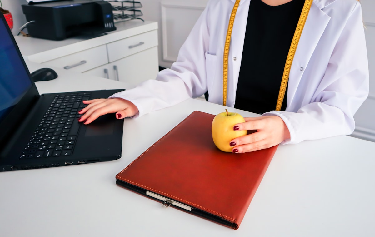 Nutritionist consulting with client about healthy eating